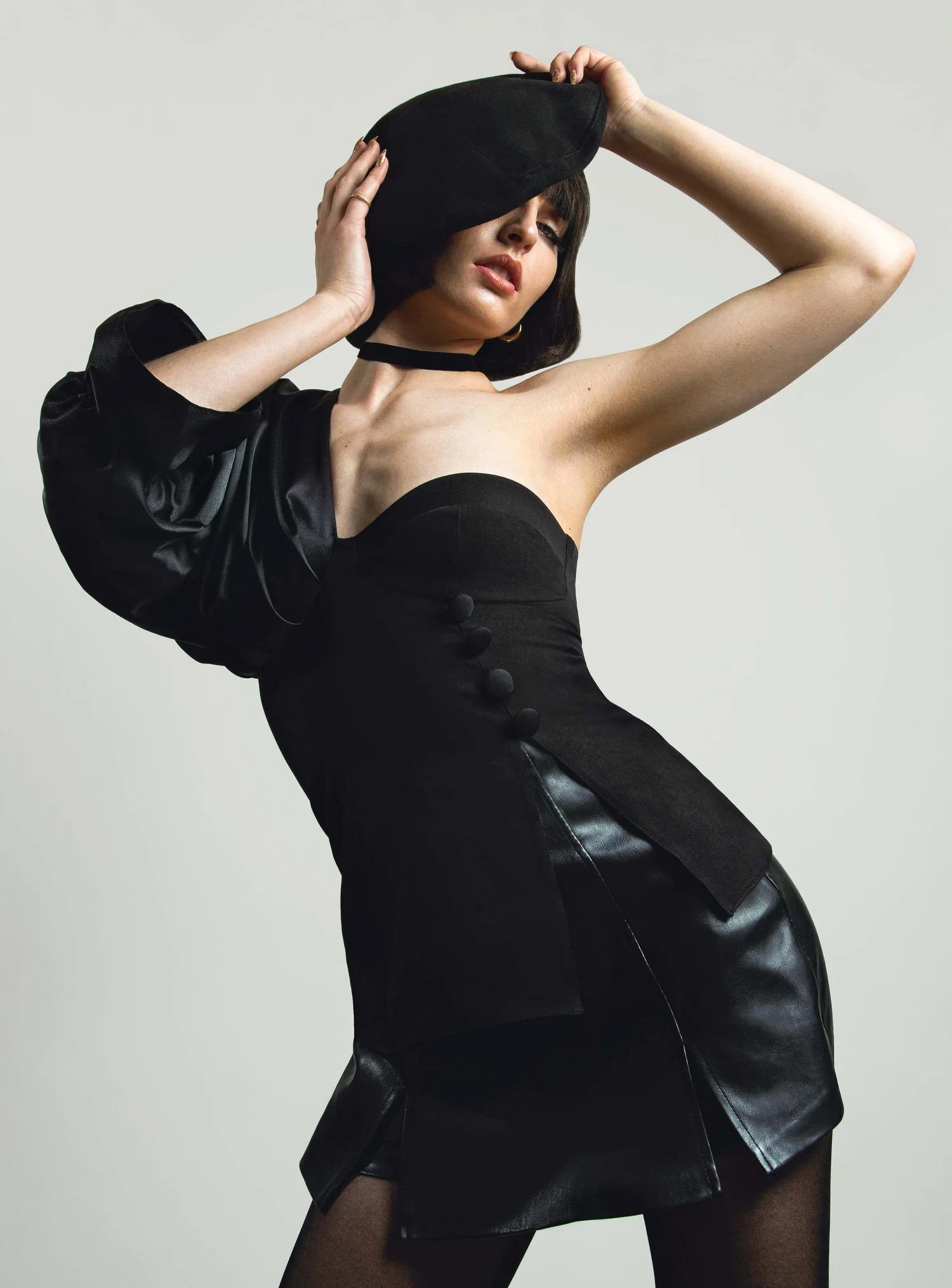 Fashion portrait of a woman holding her beret