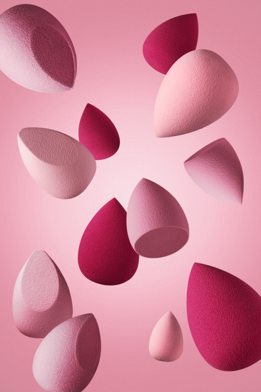 Product shot of multiple pink beauty blenders